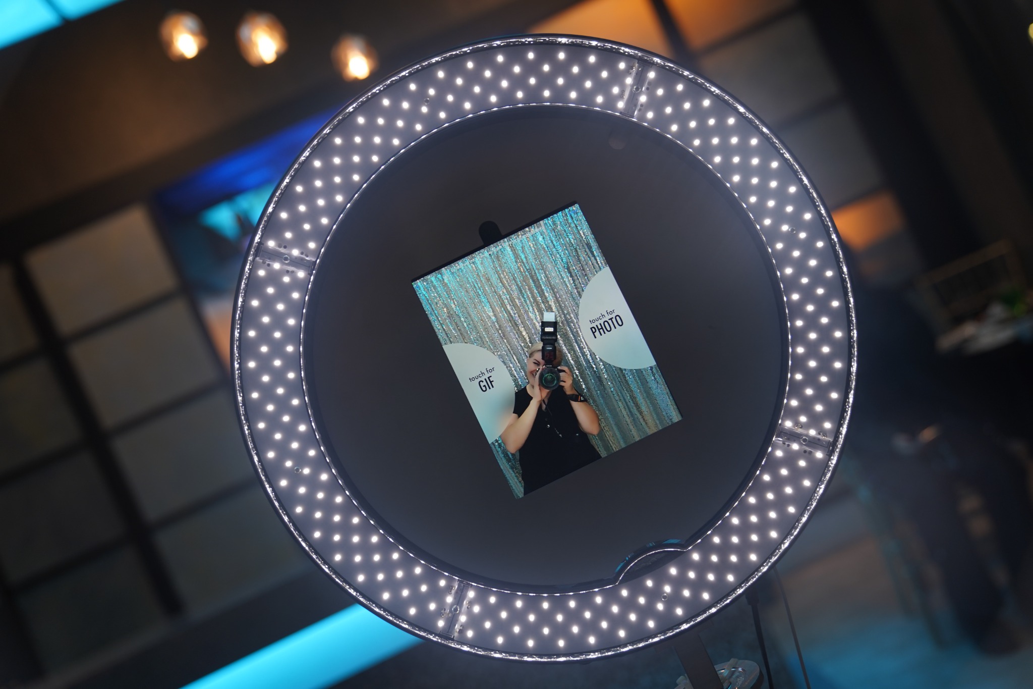 OmegaPix photographer working behind the camera at an event