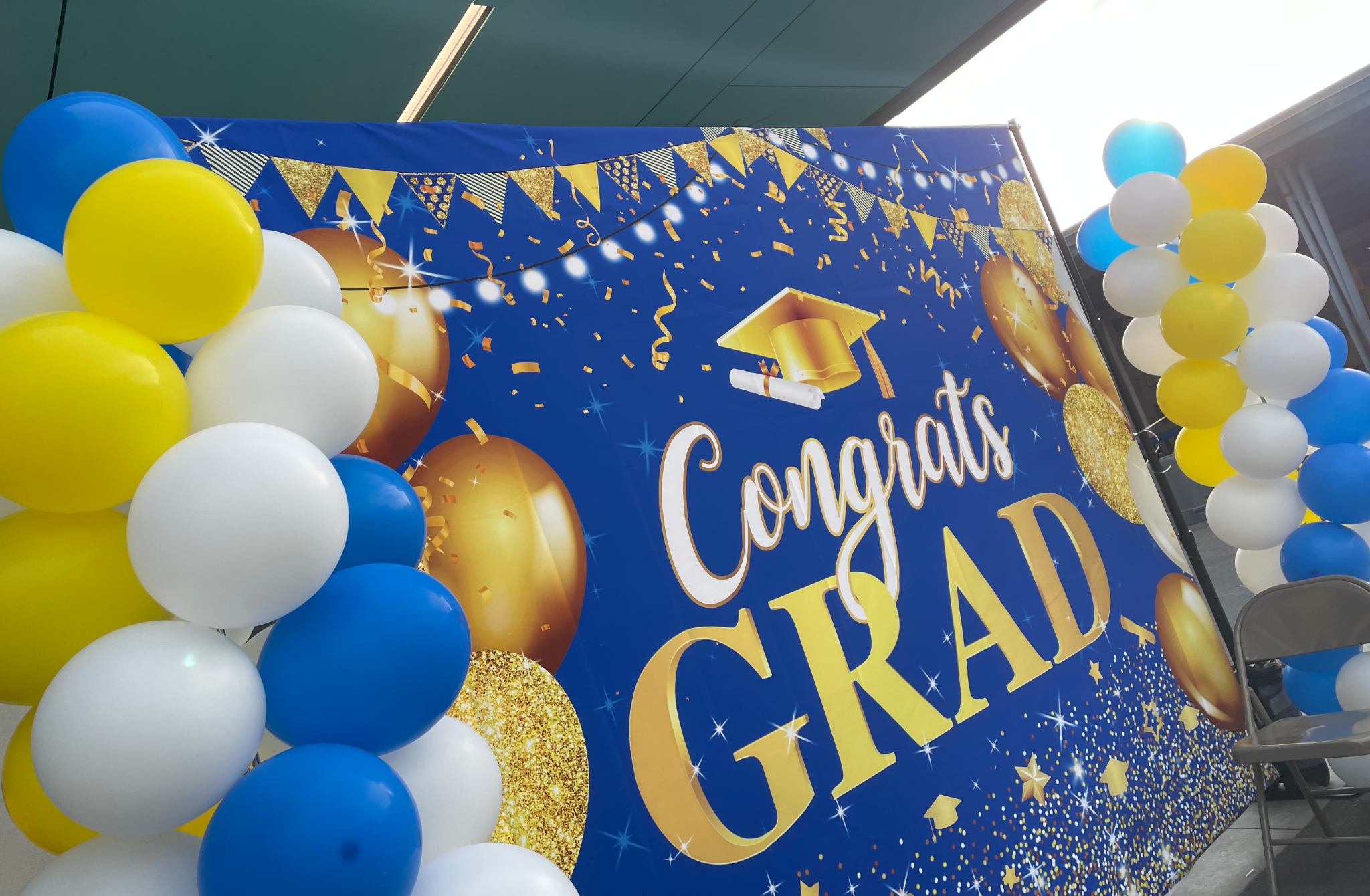 Graduation balloon and backdrop decor by OmegaPix