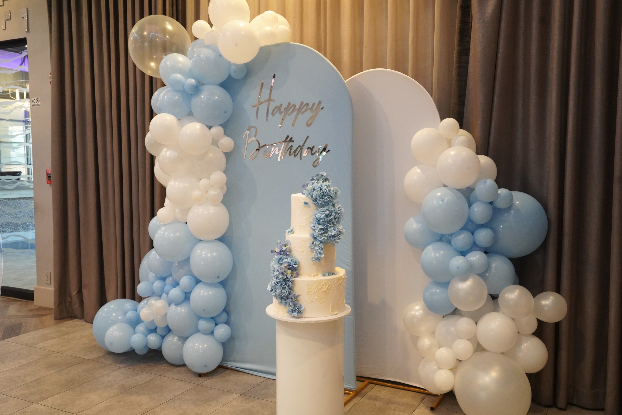Blue and white balloon backdrop styled by OmegaPix